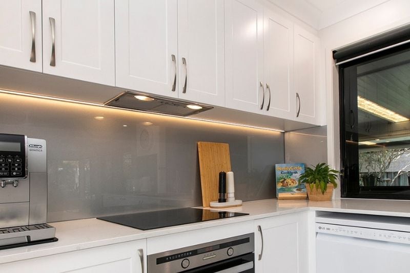 A beautiful modern kitchen with a new splashback