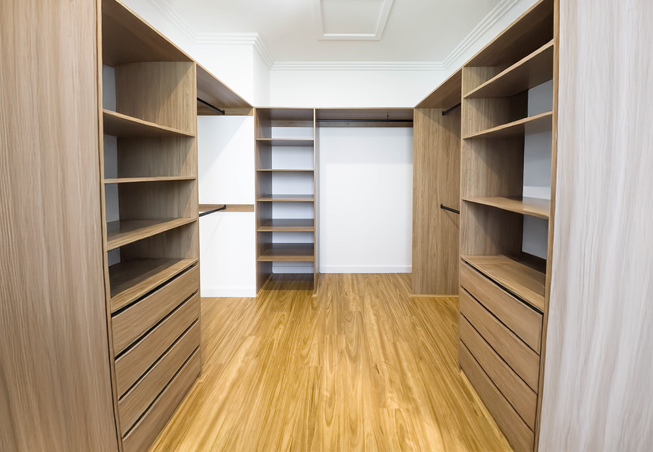 A designer sketching a custom wardrobe interior.